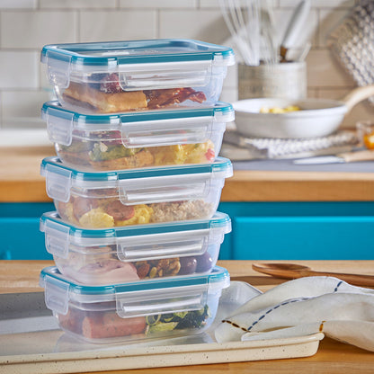 Total Solution™ 10-piece Rectangular Plastic Food Storage Set on counter with food inside. containers stacked