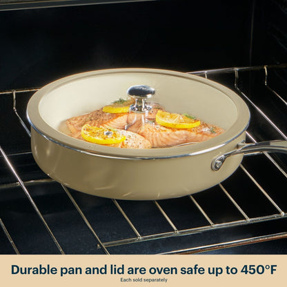 Beige ceramic cookware set with salmon dish inside an oven
