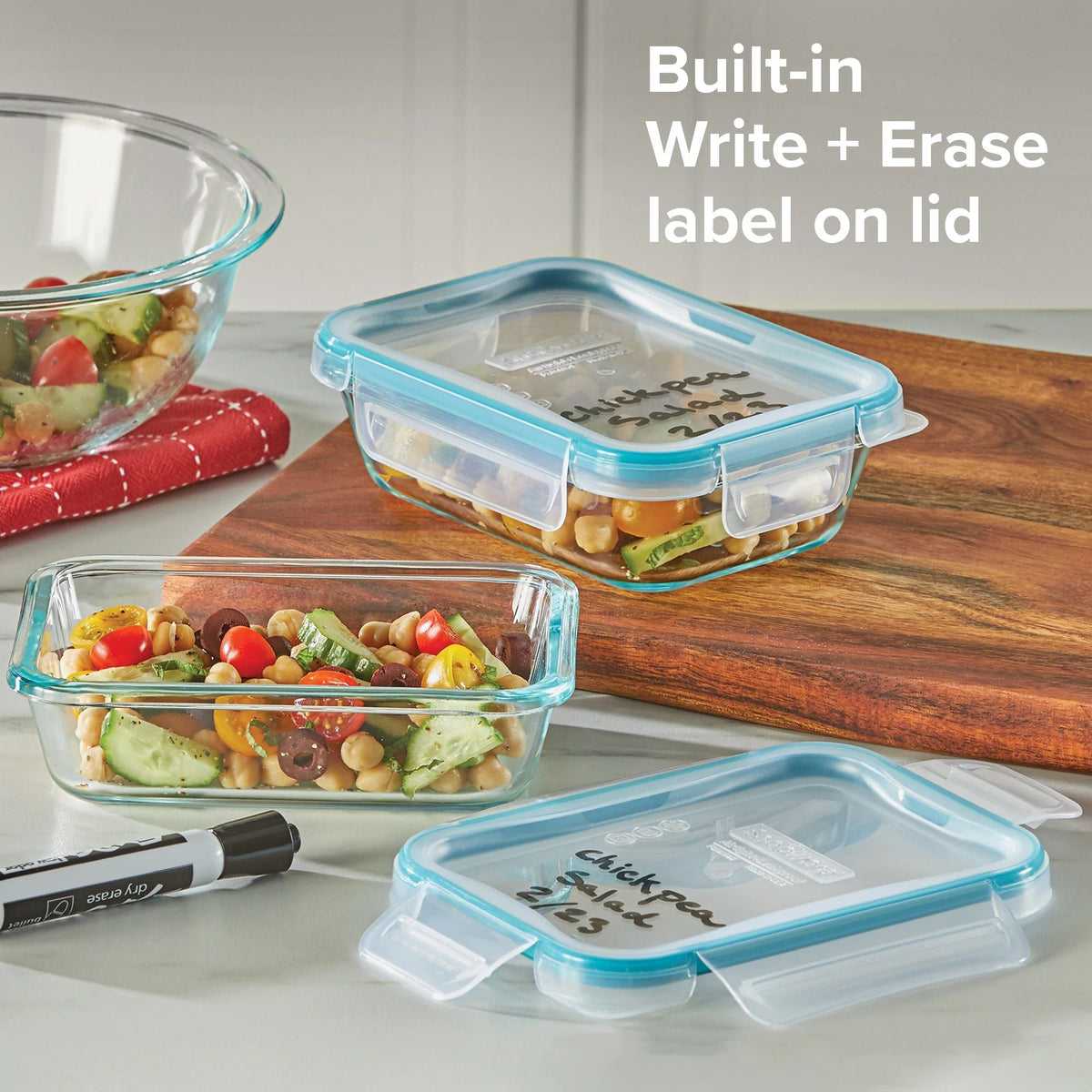Total Solution Pyrex 4-pc Glass Storage Set on table with text on photo built in write &amp; erase label on lid